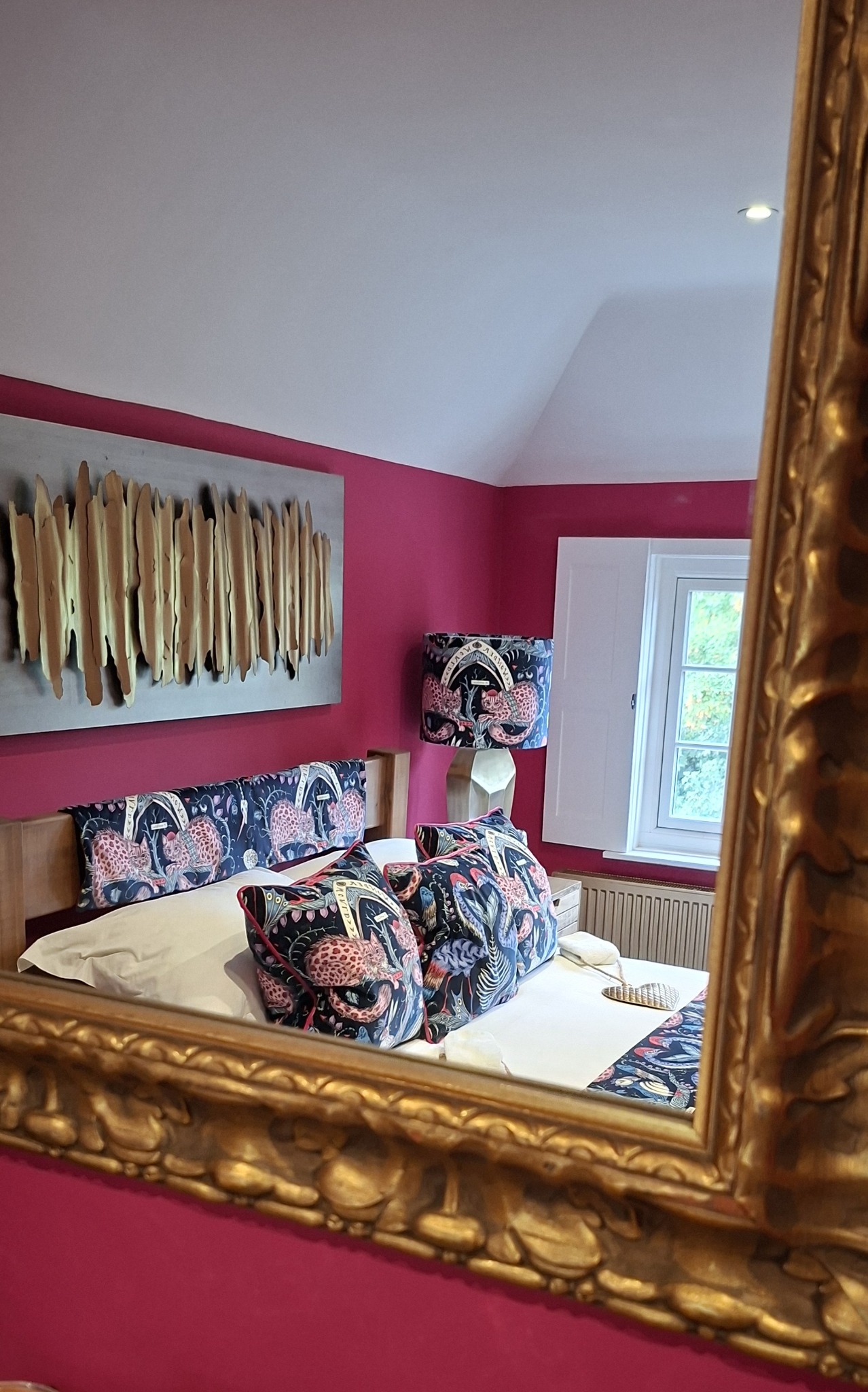 Estella room reflected in an antique gold mirror