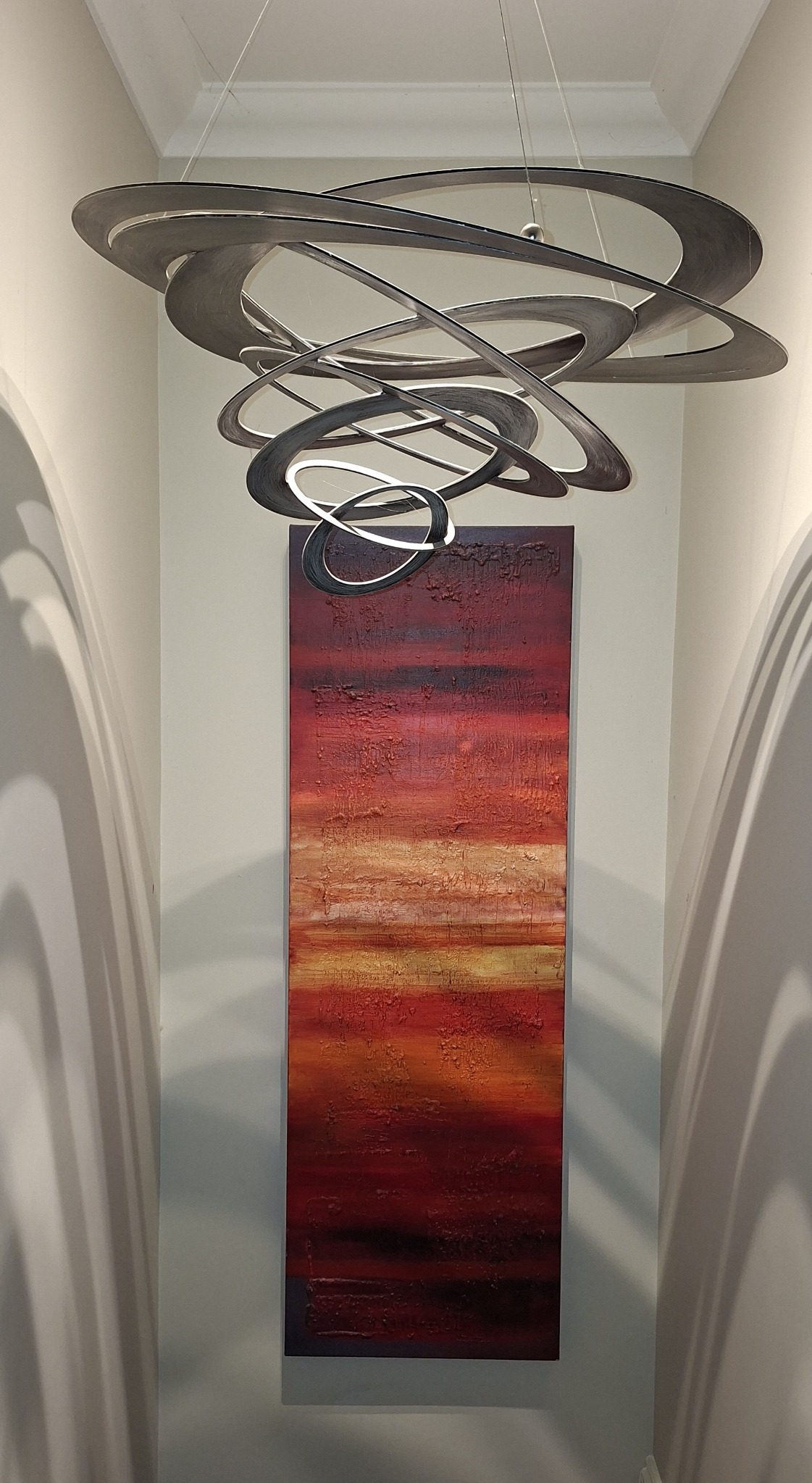Handmade Italian sculptural pendant light above the landing at Havisham House